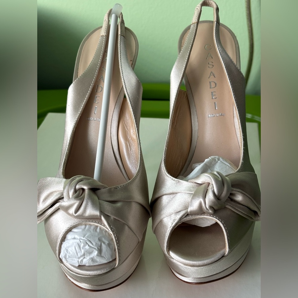 Vintage Casadei Beige silk platform heels. Never worn. Beautiful shoe. Size 8.